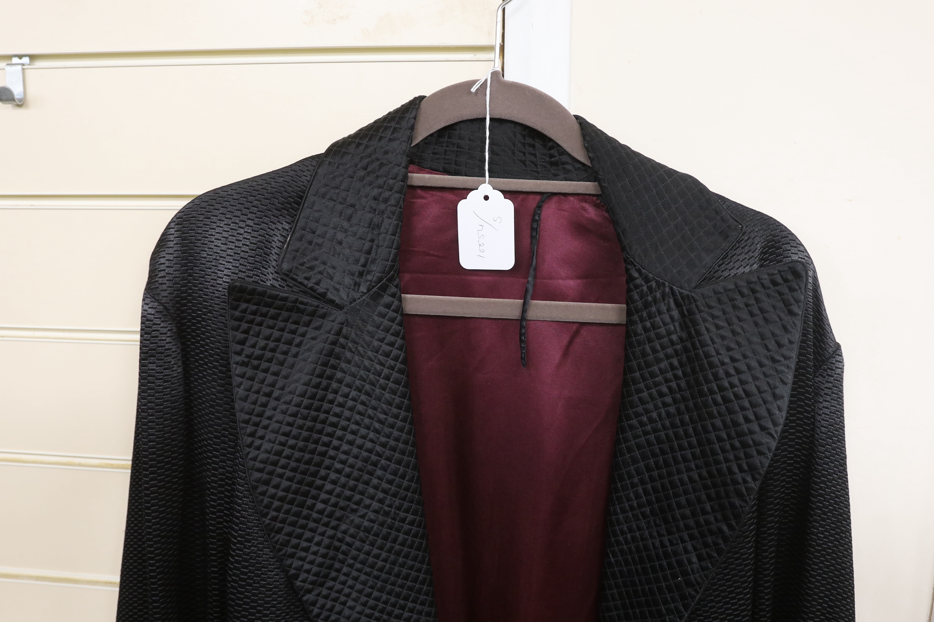 An Edwardian black silk gent smoking jacket